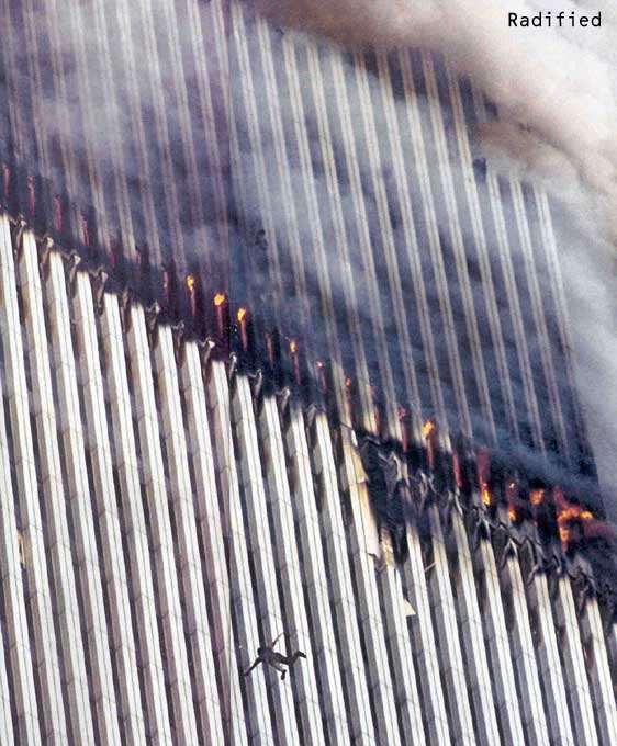 September 11, 2001. A person watches someone below leap to their certain death from the burning World Trade Center Tower.