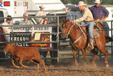 Rodeo cowboy demonstrates proper calf-roping technique