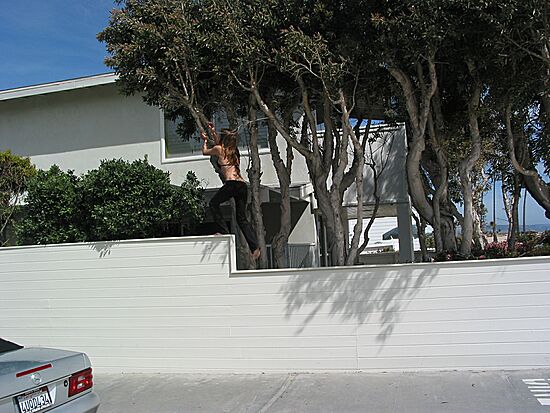 Julie climbs the wall: the strand, Balboa Peninsula, Newport Beach, California