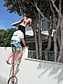 Julie mounts Eric's shoulders on his unicycle: the strand, Balboa Peninsula, Newport Beach, California