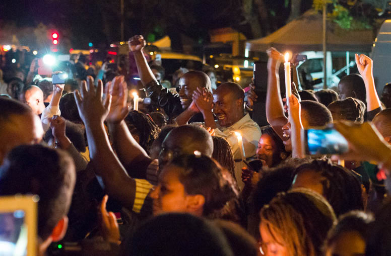 Africans gather outside Mandela's home in Johannesburg, South Africa following news of his death