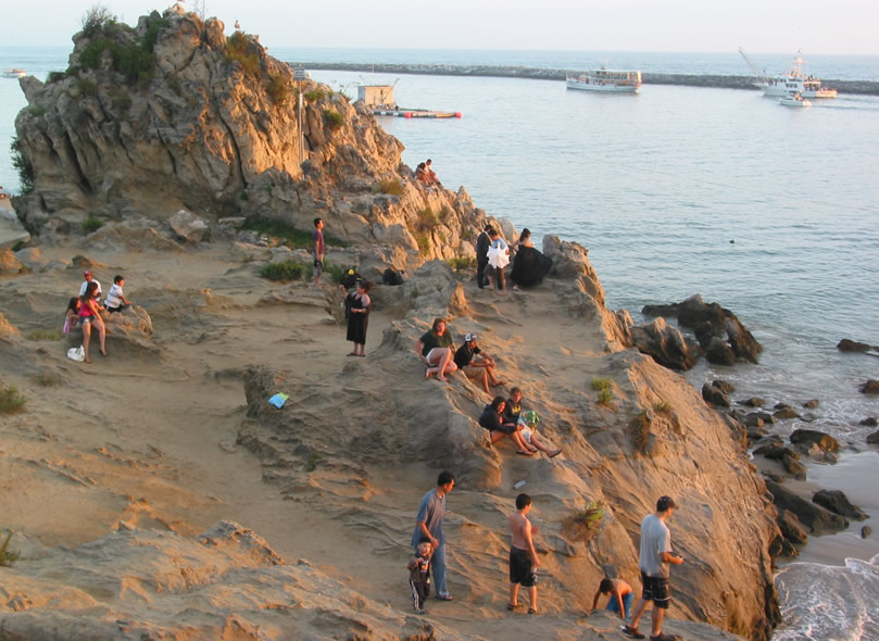 Climbing on the Rocks at Big Corona in Corona del Mar, Newport Beach, California