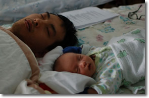 Peter & his infant son fast asleep