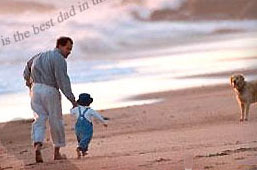 A good dad, walking the beach
